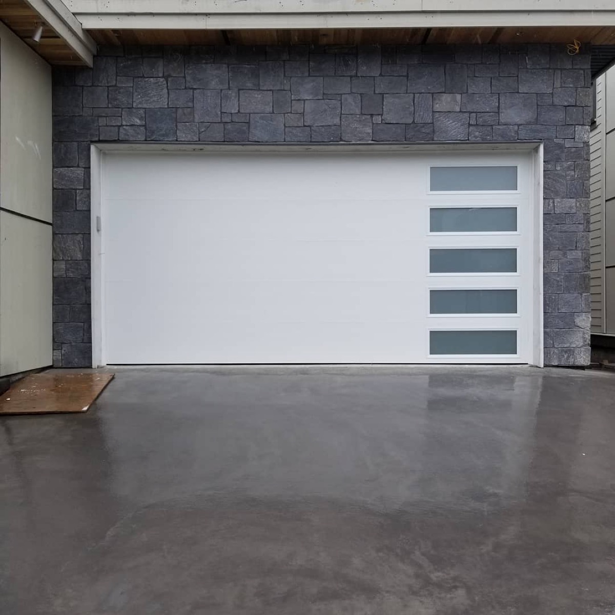 Modern white panel garage door replacement, San Diego home